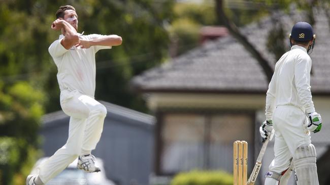 Adam McMaster bends his back for Dandenong. Picture: Valeriu Campan