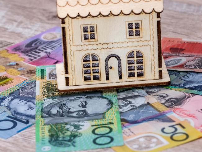 House model with australian dollar banknotes on table, generic money housing