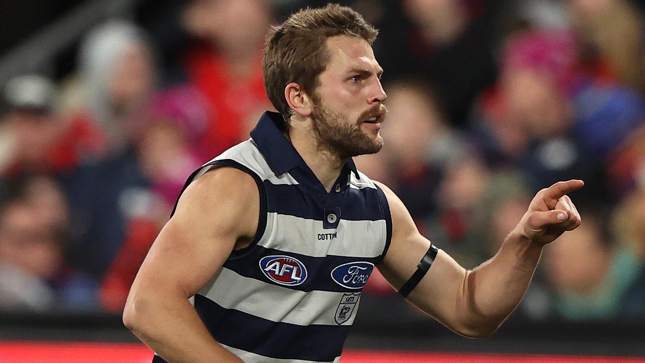 GEELONG, AUSTRALIA - JULY 07: Tom Atkins of the Cats celebrates after scoring a goal during the round 17 AFL match between the Geelong Cats and the Melbourne Demons at GMHBA Stadium on July 07, 2022 in Geelong, Australia. (Photo by Robert Cianflone/Getty Images)