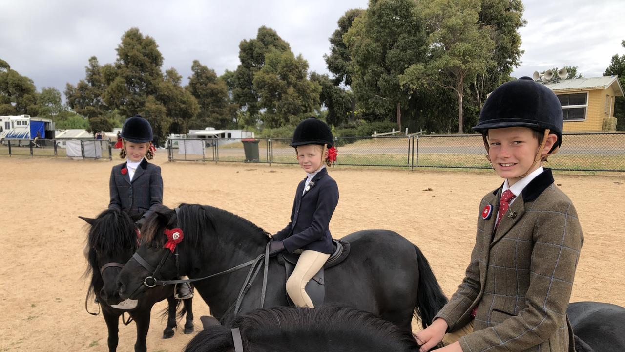 Siblings Cruize, 12, Marley, 10, and Amity, 8, Thorpe at the Bendigo Showgrounds competing in the Victorian All Shetland Show on Sunday, Dec 11, 2022