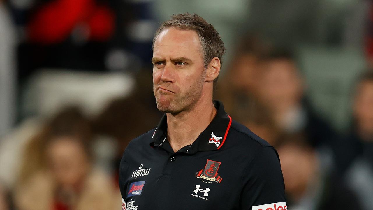 MELBOURNE, AUSTRALIA – APRIL 01: Ben Rutten, Senior Coach of the Bombers looks on during the 2022 AFL Round 03 match between the Melbourne Demons and the Essendon Bombers at the Melbourne Cricket Ground on April 01, 2022 In Melbourne, Australia. (Photo by Michael Willson/AFL Photos via Getty Images)