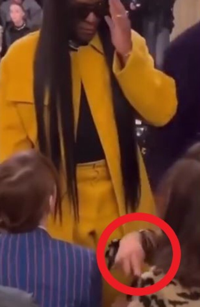 Zendaya points for Roach to sit in the row behind her.