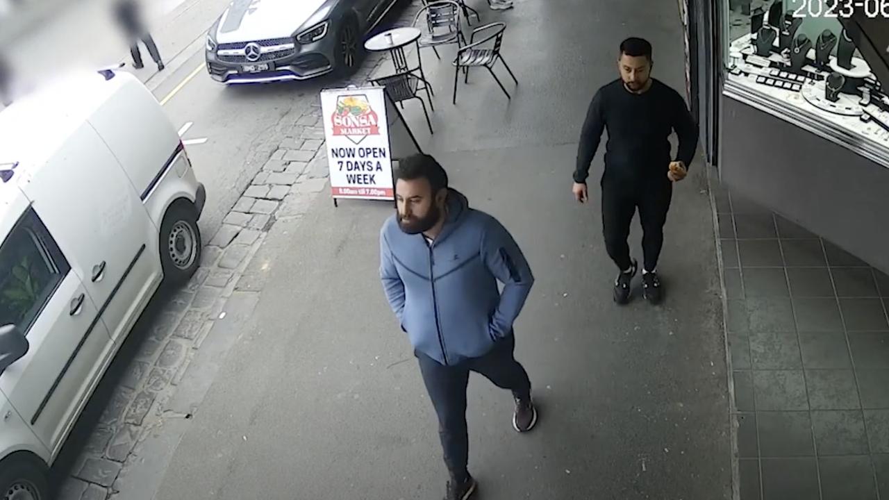 Victoria Police are hoping to speak to the two men pictured after an alleged arson in Collingwood. Picture: Victoria Police