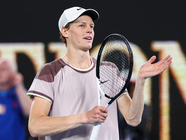 Italy's Jannik Sinner celebrates after victory against Russia's Andrey Rublev during their men's singles quarter-final match on day 10 of the Australian Open tennis tournament in Melbourne on January 24, 2024. (Photo by David GRAY / AFP) / -- IMAGE RESTRICTED TO EDITORIAL USE - STRICTLY NO COMMERCIAL USE --