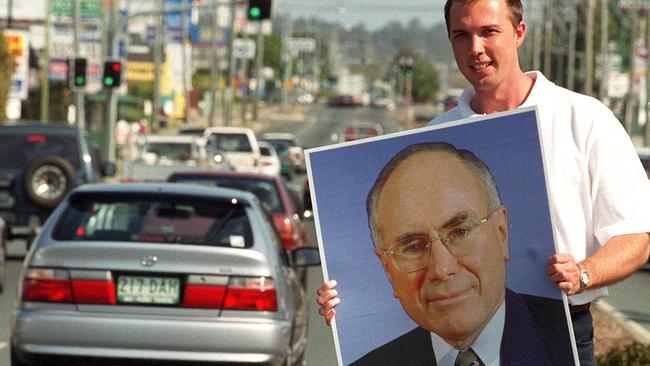 ## HAVE YOU /CHECKED COPYRIGHT /CLEARANCE ?? 13 oct 2001 Liberal candidate for dickson,Peter Dutton on Gympie Rd, Strathpine picNathan/Richter poster of Pm John Howard elections federal street scene