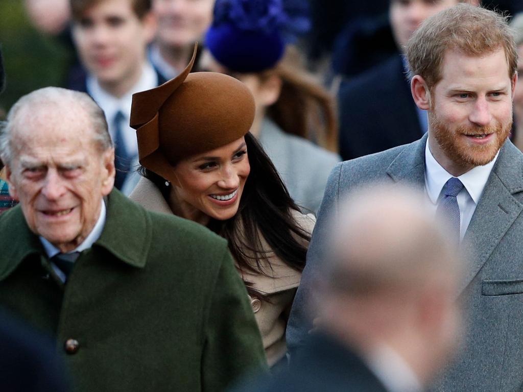 Prince Philip with Meghan and Harry in 2017. Picture: AFP