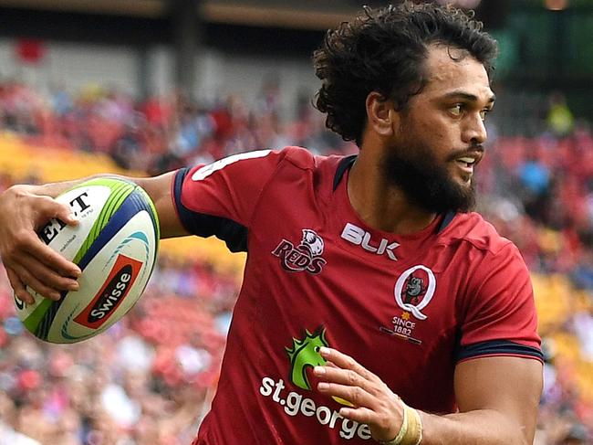 Karmichael Hunt of the Queensland Reds crosses over to score a try during their round 8 Super Rugby game against the Southern Kings at Suncorp Stadium in Brisbane, Saturday, April 15, 2017. (AAP Image/Dan Peled) NO ARCHIVING, EDITORIAL USE ONLY