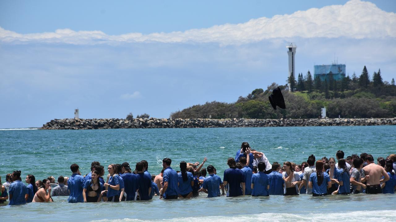 Year 12 graduates from schools across the Sunshine Coast hit to the water at Mooloolaba Beach to celebrate the end of their schooling. Photo: Mark Furler