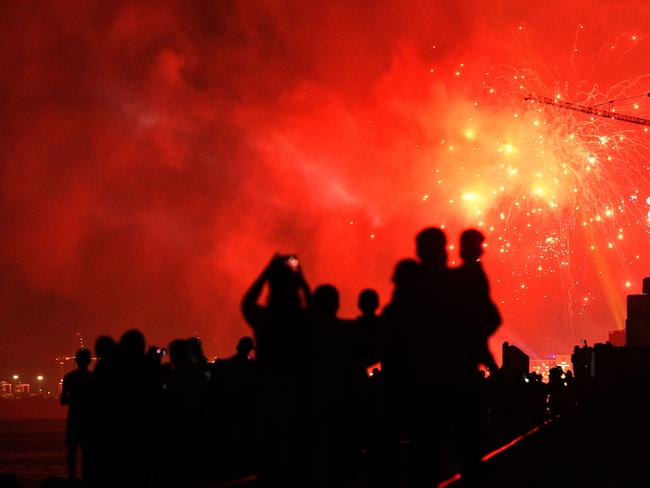 Sri Lankans watch fireworks during new year's celebrations in Colombo. Picture: AFP