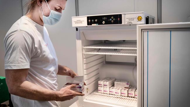 Medical personnel takes AstraZeneca vaccines out of the freezer in Copenhagen. Picture: Getty Images.