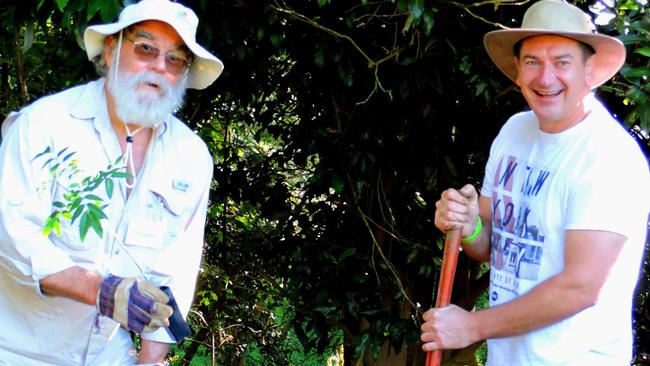 Gympie Landcare president Ernie Rider (left) planting trees with Member for Wide Bay Lew O’Brien.