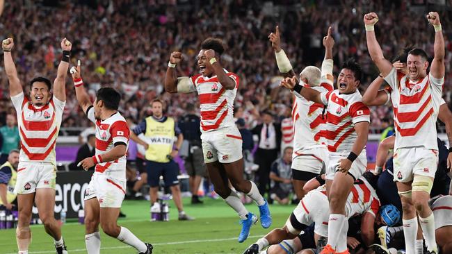 Japan players celebrate making history. Picture: William West/AFP