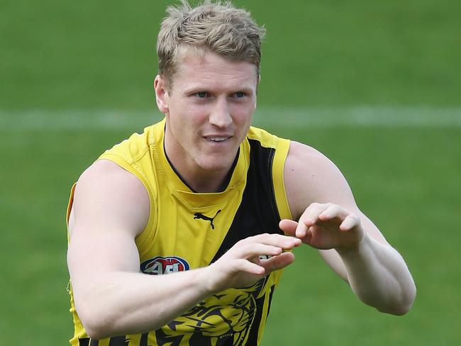 MELBOURNE, AUSTRALIA - SEPTEMBER 07:  Josh Caddy of the Tigers marks the ball during a Richmond Tigers AFL training session at Punt Road Oval on September 7, 2017 in Melbourne, Australia.  (Photo by Michael Dodge/Getty Images)