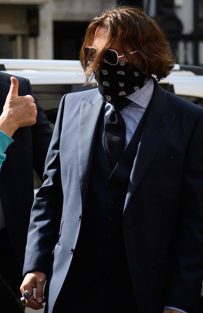 Johnny Depp has consistently worn sunglasses and a scarf covering his mouth, amid the COVID-19 pandemic. Picture: Getty Images