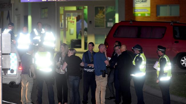 Police gather outside Endeavour Hills police station. Picture: Mike Keating