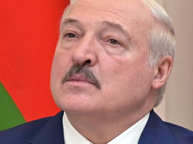 (FILES) In this file photo taken on February 19, 2022, Belarus President Alexander Lukashenko watches, alongside his Russian counterpart, training launches of ballistic missiles as part of the Grom-2022 Strategic Deterrence Force exercise, from the situational centre of the Russian Defense Ministry in Moscow. - The US on MArch 15, 2022, reauthorized sanctions against Lukashenko as it seeks to punish countries that supported Russia's invasion of Ukraine. The US Treasury described Lukashenko as 