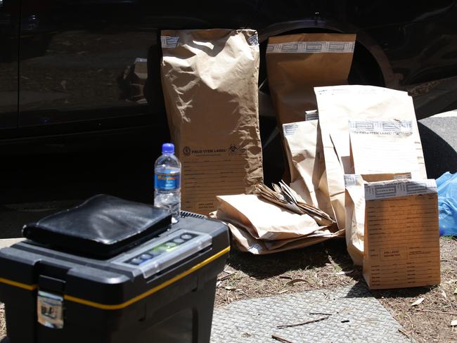 Items taken away in evidence bags during the raids. Picture: Craig Wilson