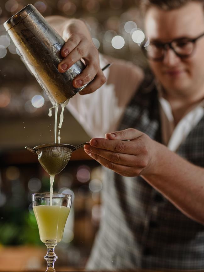 Sean’s Kitchen bartender Liam Goodwin makes a Sweet Heat cocktail. Picture: Duy Dash.