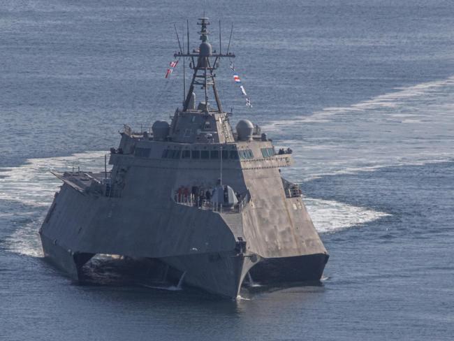 SAN DIEGO (April 19, 2023) Tugboats push the Independence-variant littoral combat ship USS Canberra (LCS 30) to a pier at Naval Air Station, North Island for an onload, prior to a routine underway off the California Coast. Littoral Combat Ships are fast, optimally manned, mission-tailored surface combatants that operate in near-shore and open-ocean environments, winning against 21st-century coastal threats. LCS integrates with joint, combined, manned and unmanned teams to support forward presence, maritime security, sea control and deterrence missions around the globe. (U.S. Navy photo by Mass Communication Specialist 1st Class Mark D. Faram)