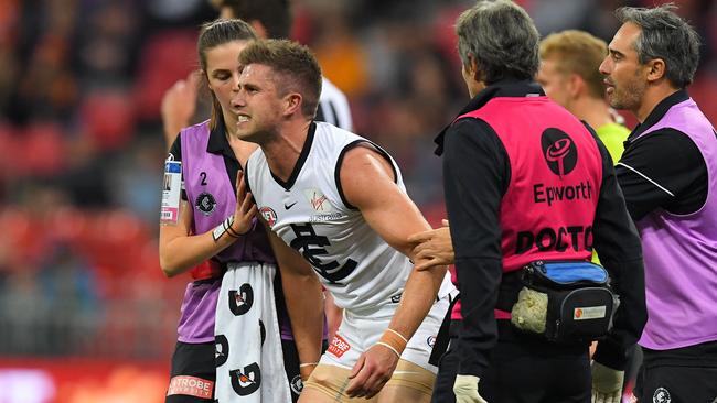 Marc Murphy had to be helped from the field. Picture: AAP