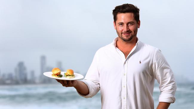 Rich Shores co-owner Nick Woodward shows off his restaurant’s epic beach views. Picture: Adam Head