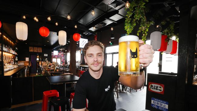 Beer bar Roji Cat opened in Miami this month and is already a hit. Venue Manager Angus Lee with beer. Picture Glenn Hampson