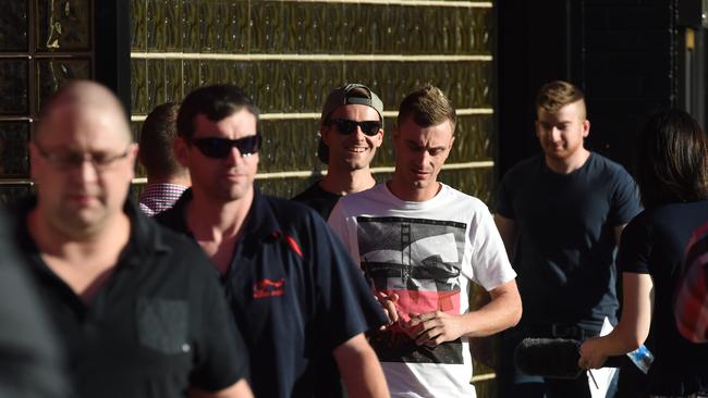 Workers leave a meeting with Coca-Cola management at the Thebarton plant. Picture: Sam Wundke