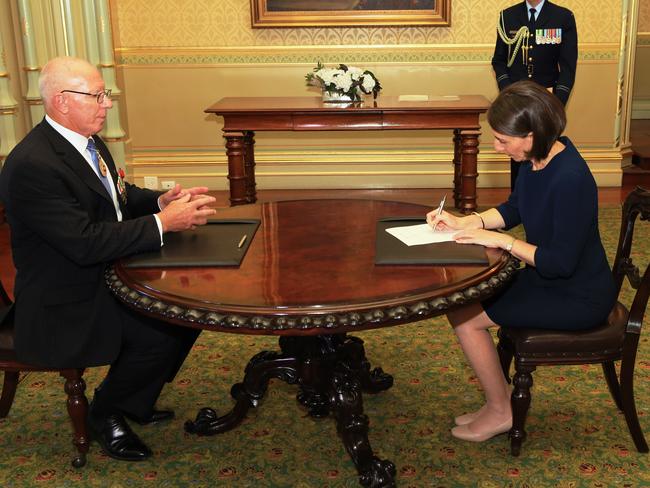 Gladys Berejiklian is sworn in as Premier by Governor David Hurley at Government House. Picture: Toby Zerna