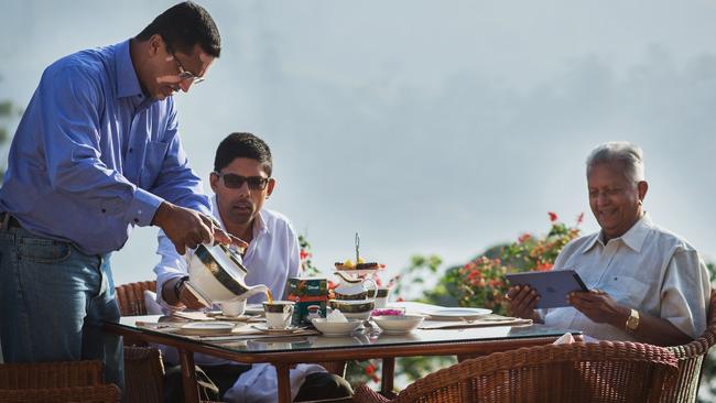 Mr Fernando with his sons Dilhan and Malik.