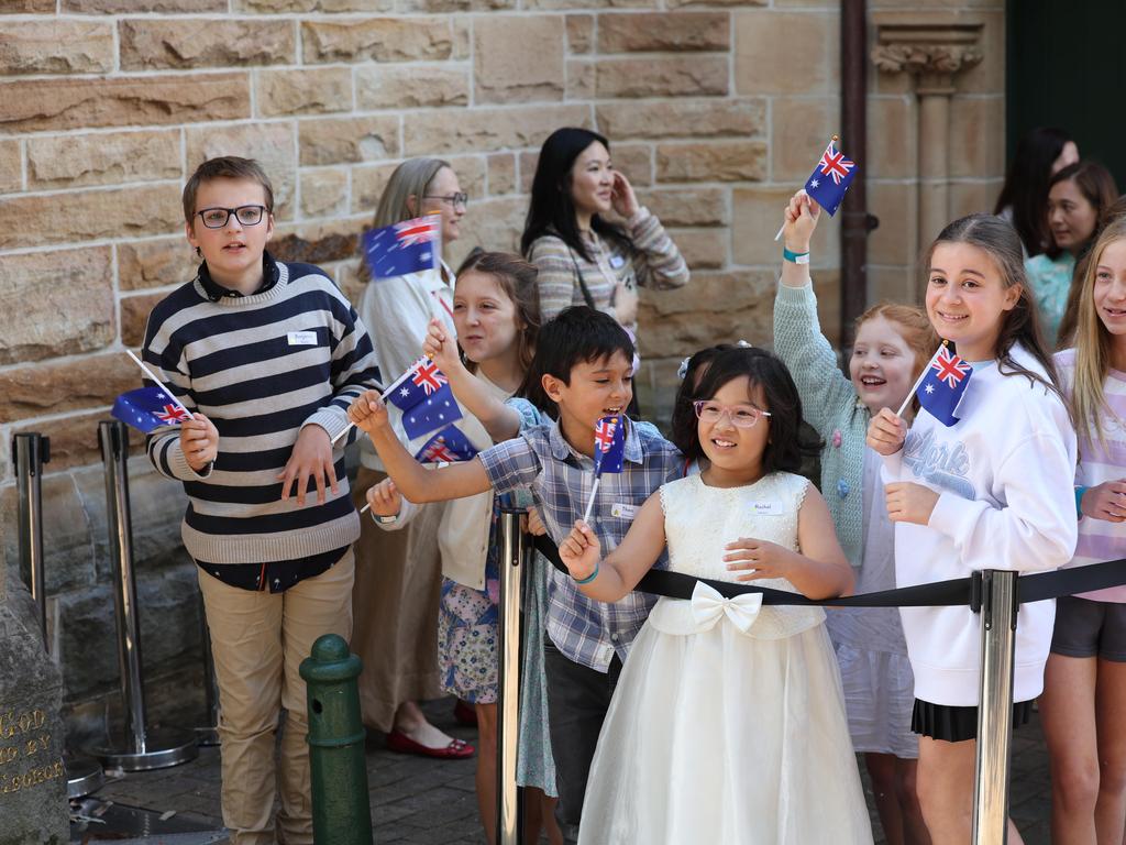 Excited children wait outside church.. Picture: Rohan Kelly