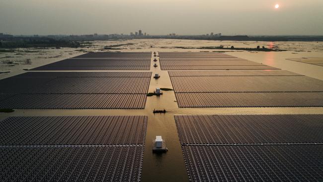 Large floating solar farm project under construction by the Sungrow Power Supply Company on a lake caused by a collapsed and flooded coal mine on June 13, 2017 in Huainan, Anhui province, China.