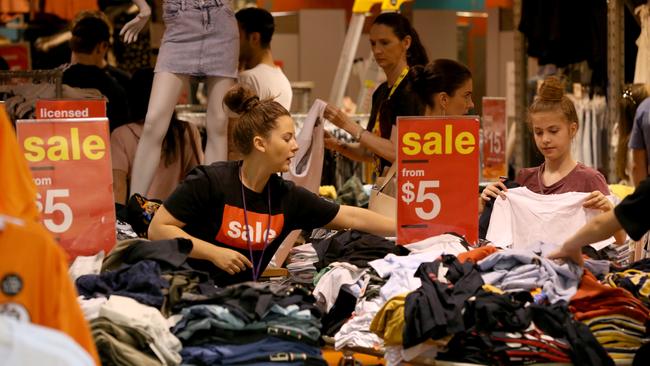 Shoppers and staff at Westfield Marion on Wednesday. Picture: AAP / Kelly Barnes