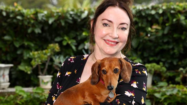 ***EMBARGOED UNTIL MONDAY FEBRUARY 15, 2021****Fashion designer Leona Edmiston pictured in her new range of clothes in a collaboration with Harris Scarfe. Leona holds her dog Daisy. Picture: Toby Zerna