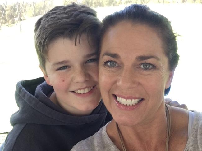 Britta Hodge with her son Logan Ford in happier times before he was confined to his bedroom.