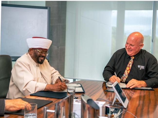 His Eminence the National Grand Mufti of Australia Imam Abdul Quddoos Azhari and CDU Vice-Chancellor Professor Scott Bowman signing a Memorandum of Understanding.