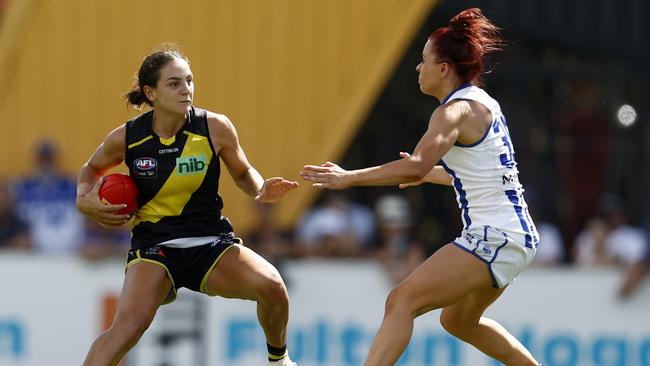 Monique Conti fends off Jenna Bruton during North Melbourne’s win.