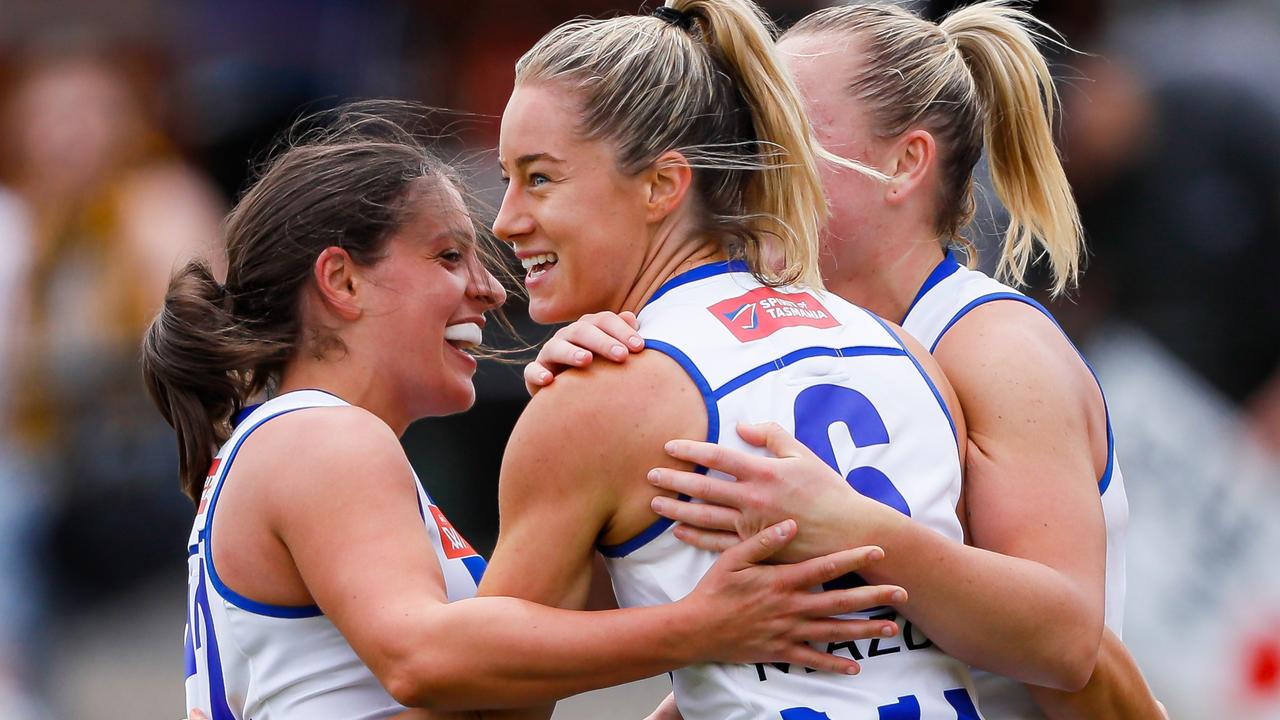 Alice O'Loughlin celebrates a goal with Vikki Wall and Ellie Gavalas. Picture: Dylan Burns/AFL Photos via Getty Images