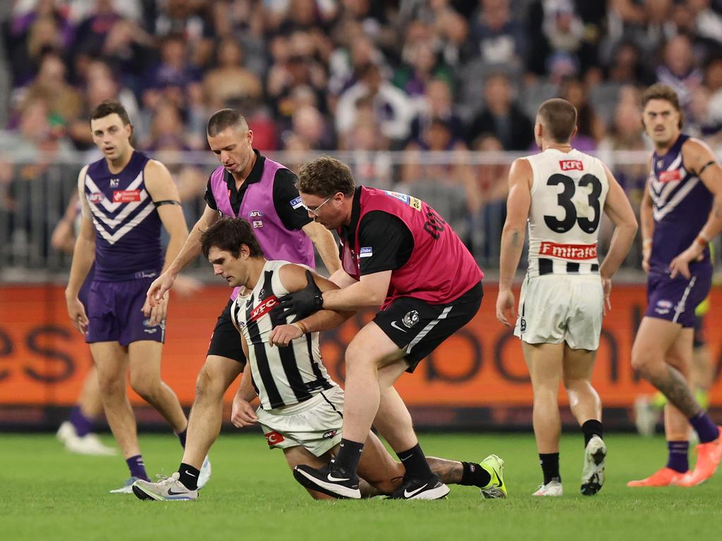 Lachie Schultz falls to the ground as he tries to walk off. Picture: Janelle St Pierre/AFL Photos