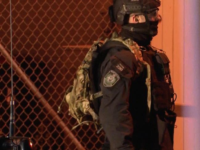 ***FEES APPLY***, ***MUST CREDIT TNV***, Screengrabs from TNV video ., Male in standoff with police after alleged threats to pour petrol over pregnant female in George st in Windsor