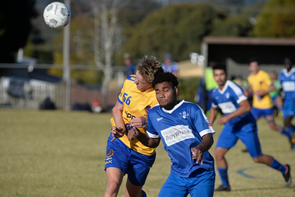 Jarrod Ott (left) of USQ FC and Patrick Manu of Rockville in Toowoomba Football League Premier Men round 14 at Captain Cook Reserve Des McGovern oval, Sunday, June 24, 2018. Picture: Kevin Farmer