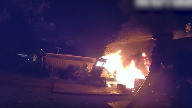 Bodywarn footage from the officer showed the caravan fully engulfed in flames when he arrived to the scene. Photo: Queensland Police