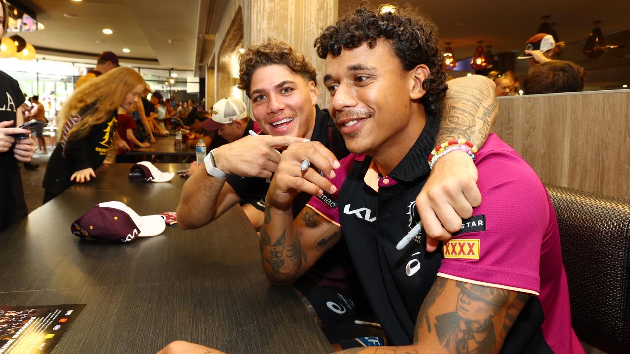 Reece Walsh and Tristan Sailor having fun at the Broncos fans day at Red Hill. Picture Lachie Millard