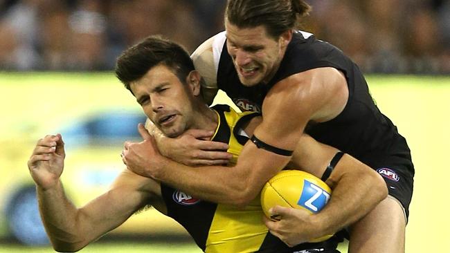 Bryce Gibbs finds a way to stop Trent Cotchin. Picture: Wayne Ludbey