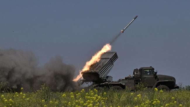 Ukrainian servicemen fire multiple rocket launchers towards Russian positions at a front line near Bakhmut in the Donetsk region.