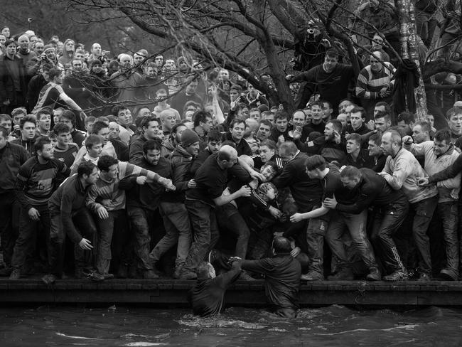 Members of opposing teams, the Up’ards and Down’ards, grapple for the ball during the historic, annual Royal Shrovetide Football Match in Ashbourne, Derbyshire, UK. Picture: Oli SCARFF/AFP/World Press Photo