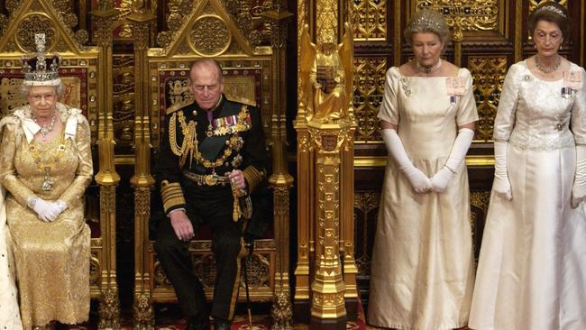 Queen Elizabeth II and Prince Philip at the opening of Parliament, they are accompanied by ladies-in-waiting Diana Lady Farnham and Lady Susan Hussey.