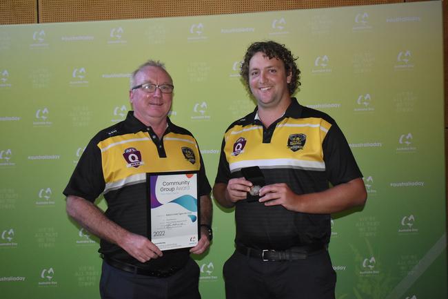 Ben Faulkner and Ashley Ryan accepting the Community Group Award on behalf of Bakers Creek Tigers AFL Club at the Mackay Australia Day awards at the MECC on January 25, 2022. Picture: Lillian Watkins