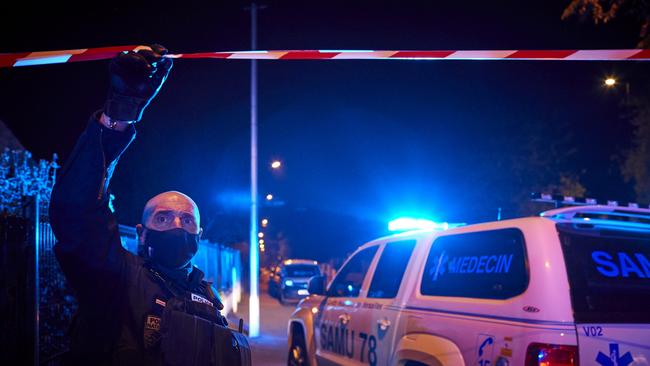 Police at the scene where police shot a man after he decapitated a middle school teacher and posted the act on social media on October 16, 2020 in Conflans-Sainte-Honorine, France. Picture: Getty