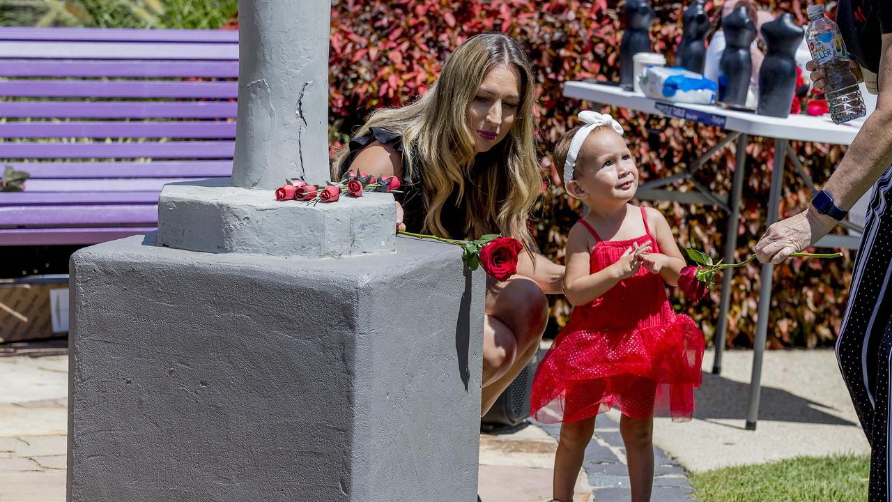 The red Rose DV rally at the DV memorial in Norm Rix park, Labrador. LNP candidate Laura Gerber with Myra Marsh, 18 months. Picture: Jerad Williams