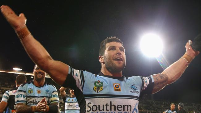 Michael Ennis of the Sharks celebrates victory.